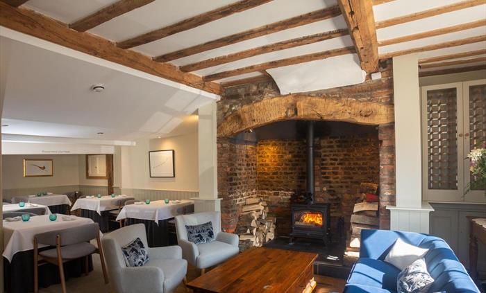 Inside the restaurant by the fireplace